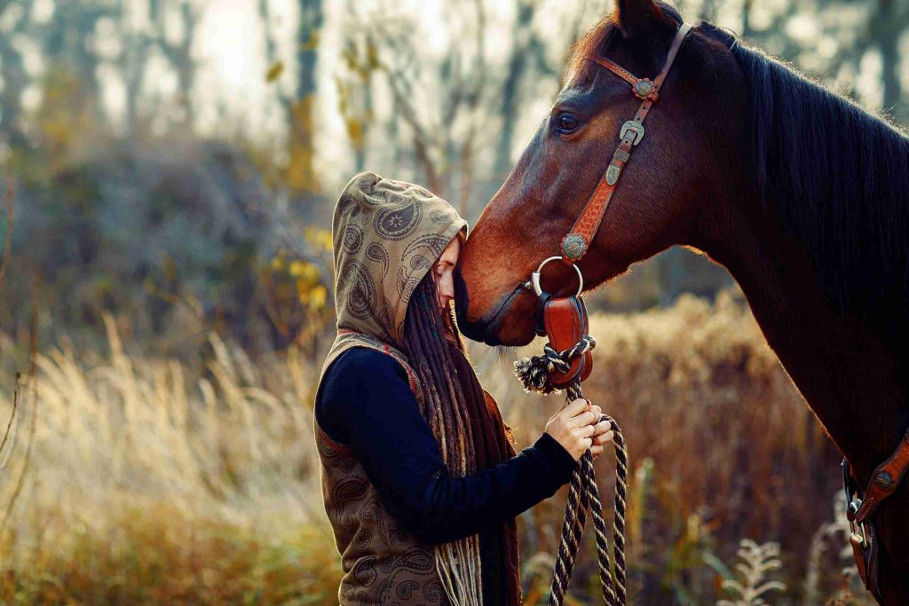photo of woman nose to nose with horse, healing grace, equine healing